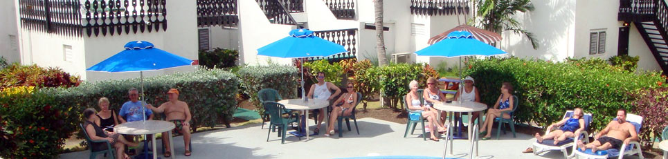 Enjoy a relaxing day under the umbrella at the pool at Barbados Plum Tree Club