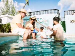 family enjoying the pool 