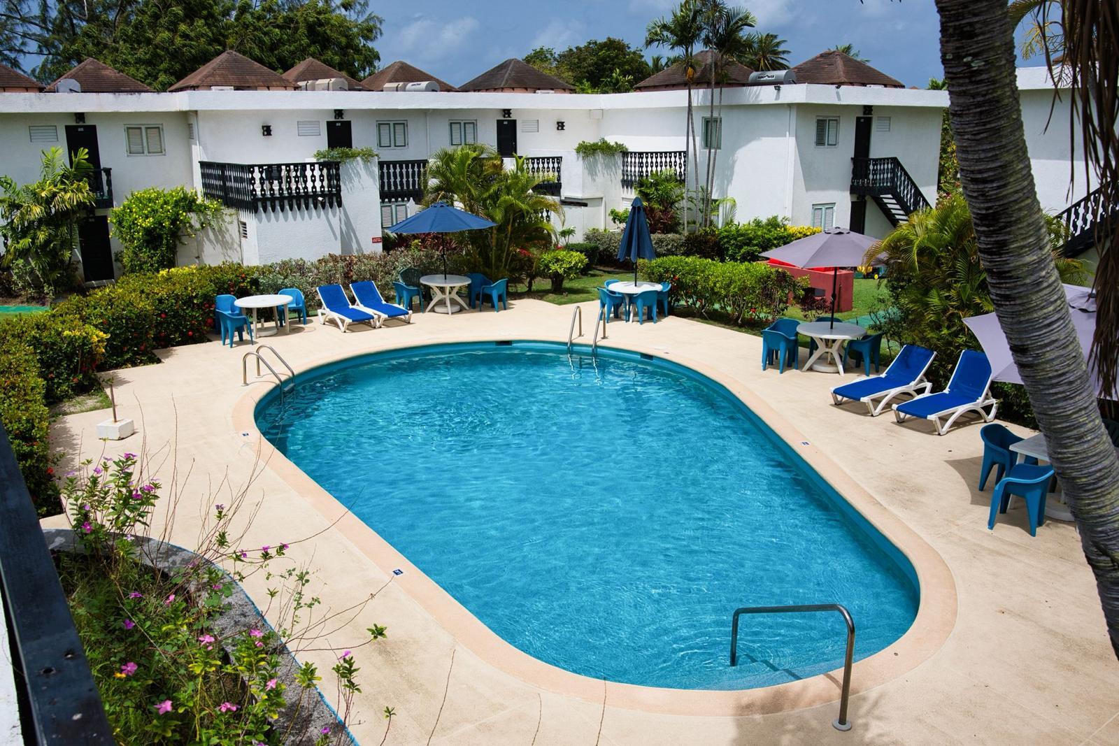 Swimming pool and garden terrace at Plum Tree Club, Rockley, Barbados
