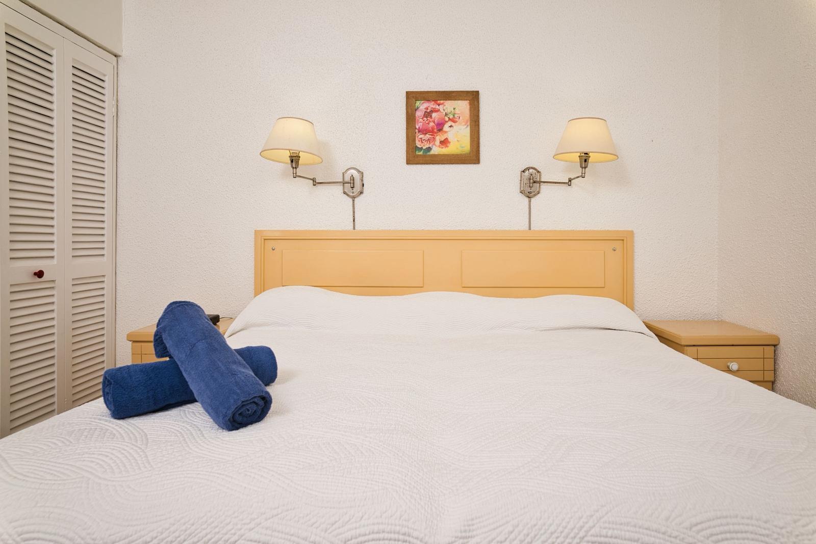 Double bedroom at Plum Tree Club made up with fresh linen and towels